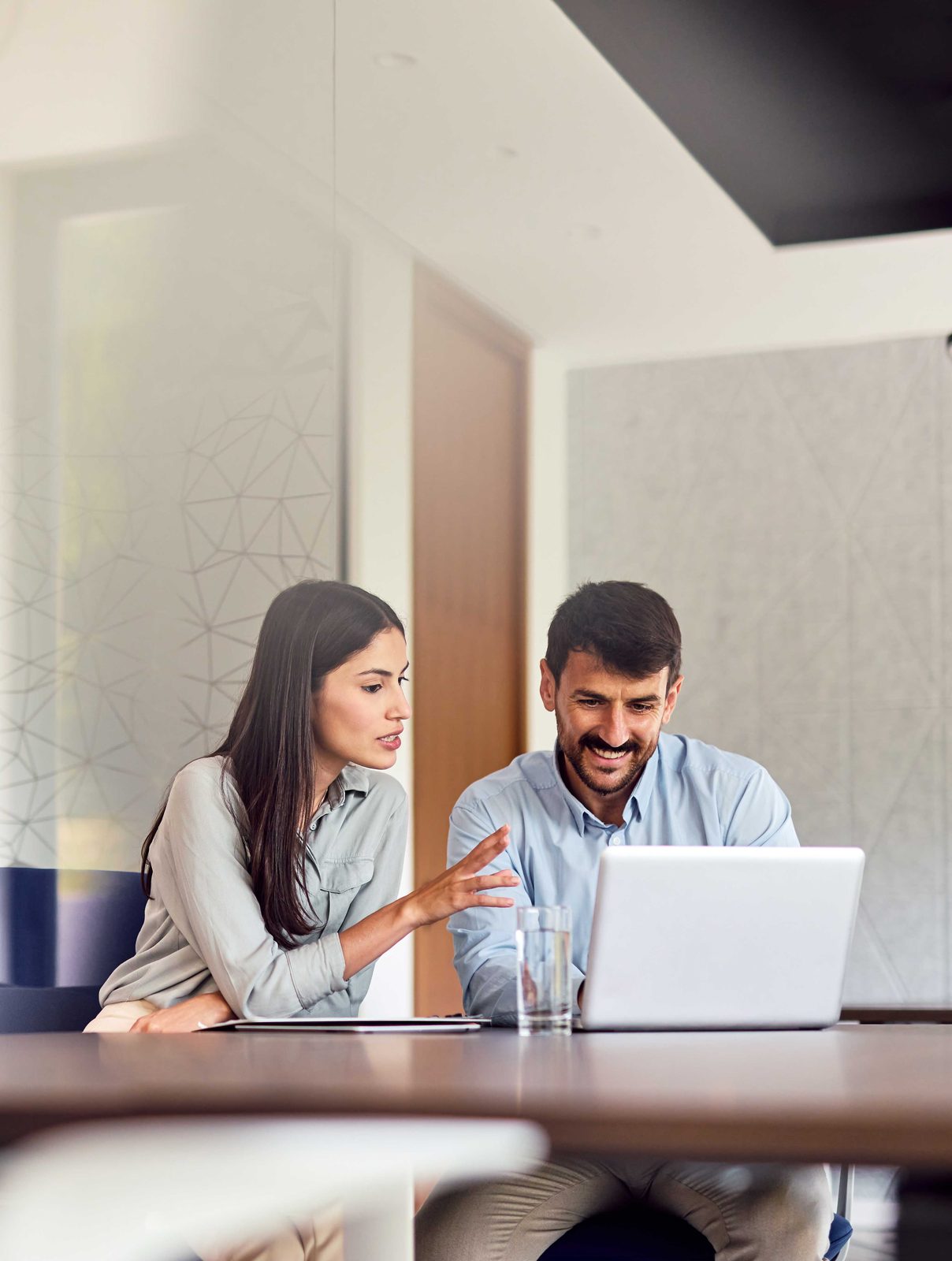 Two MEDTEAM revenue cycle specialists reviewing an account together